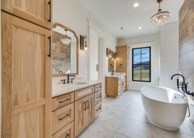 modern bathroom with natural wood cabinets and wall